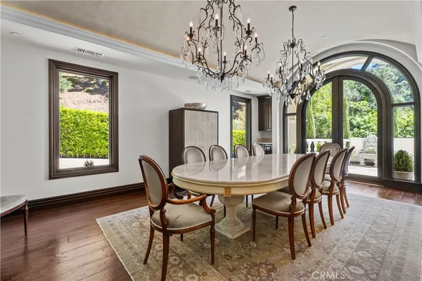 a view of a dining room with furniture window and wooden floor