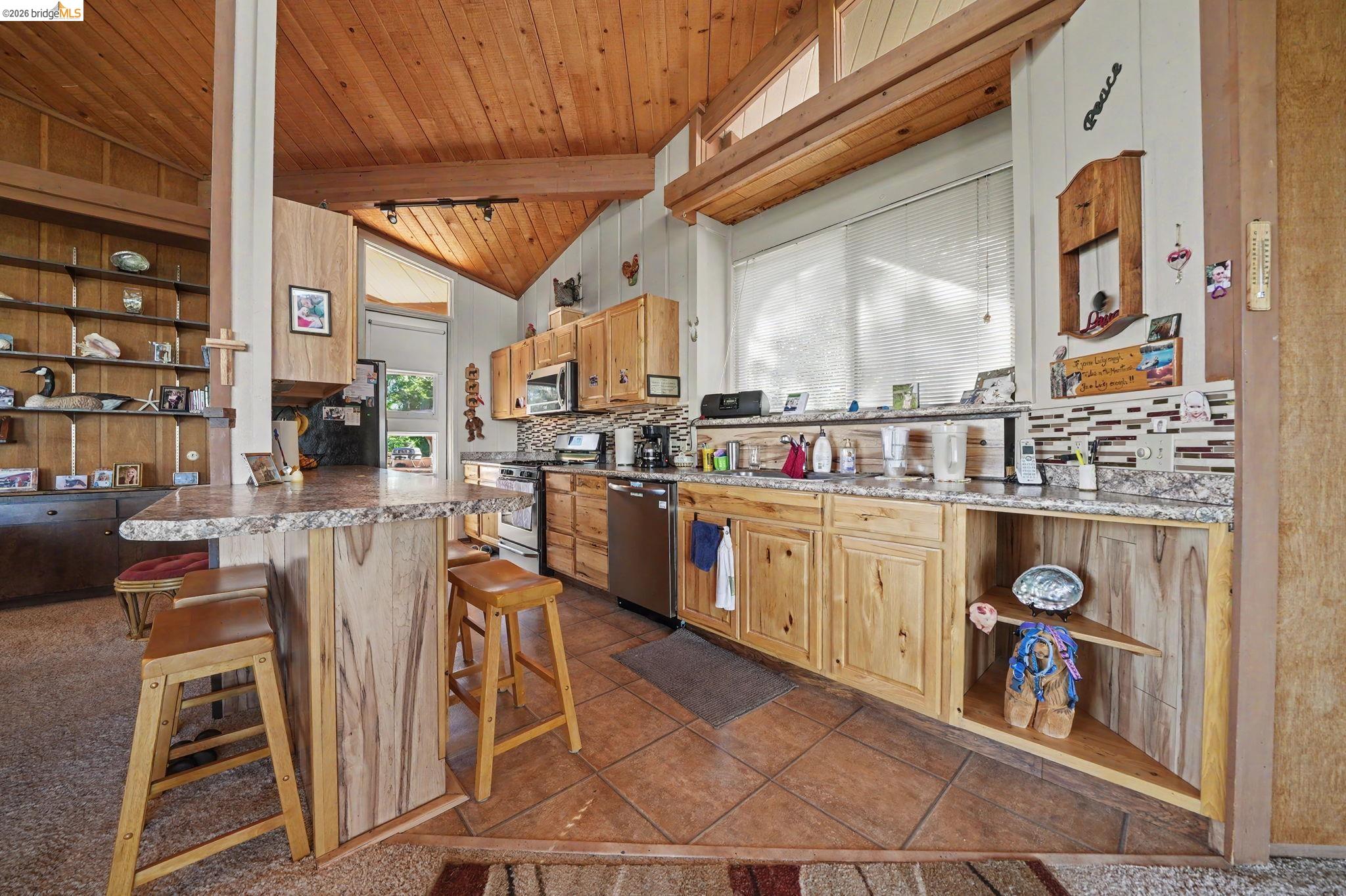 6161 Fullen Road Murphys, CA 95247 - Photo 29 of 53 a kitchen with stainless steel appliances granite countertop a stove a sink and a refrigerator
