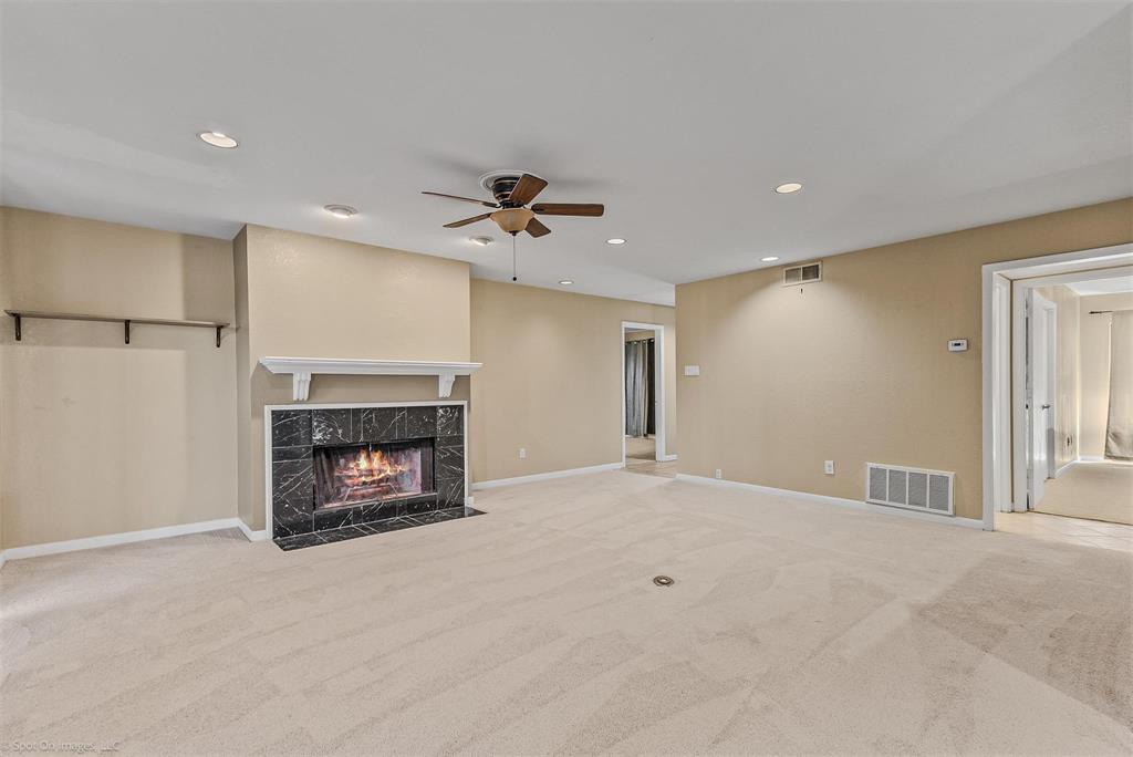 925 Signal Ridge Place Rockwall, TX 75032 - Photo 7 of 21 a view of an empty room with a fireplace