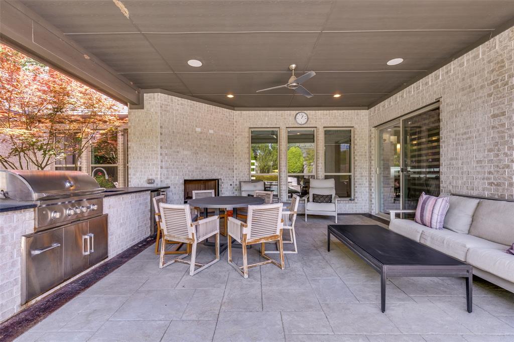 3755 Northview Lane Dallas, TX 75229 - Photo 32 of 36 Covered porch with built in sink and gas grill, also has a gas fireplace and lots of room for family and friends to gather.