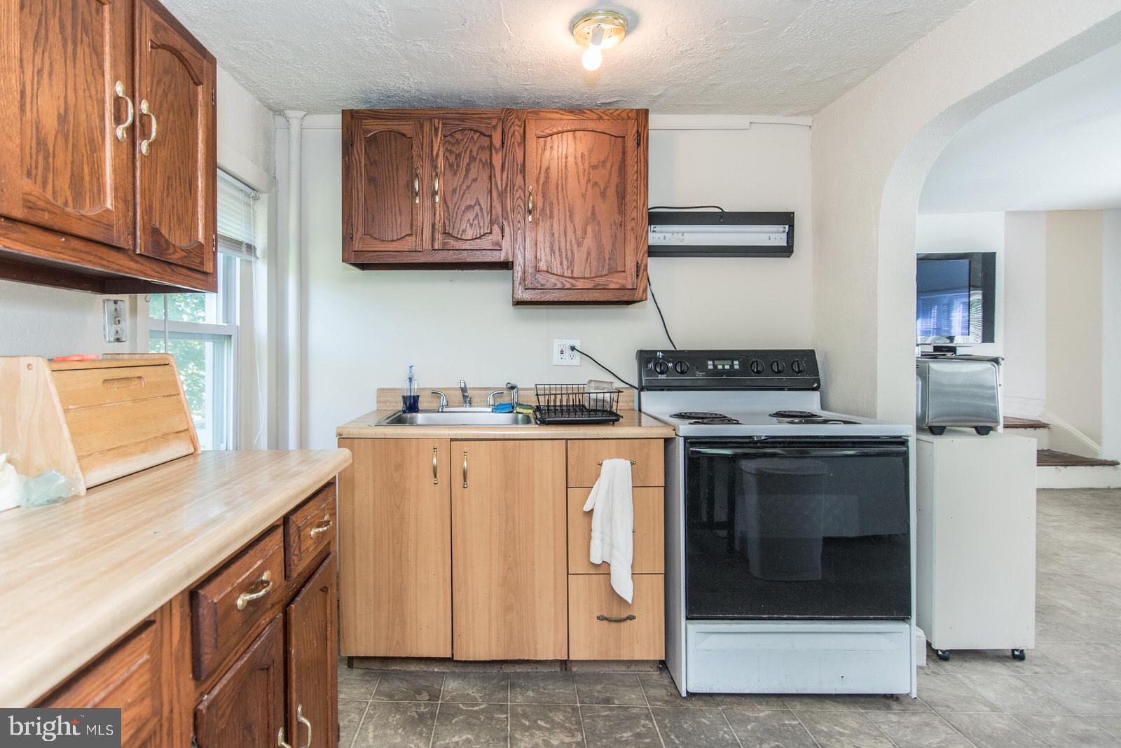 169 State Rd. Bensalem, PA 19020 - Photo 64 of 100 a kitchen with stainless steel appliances granite countertop a stove and a refrigerator
