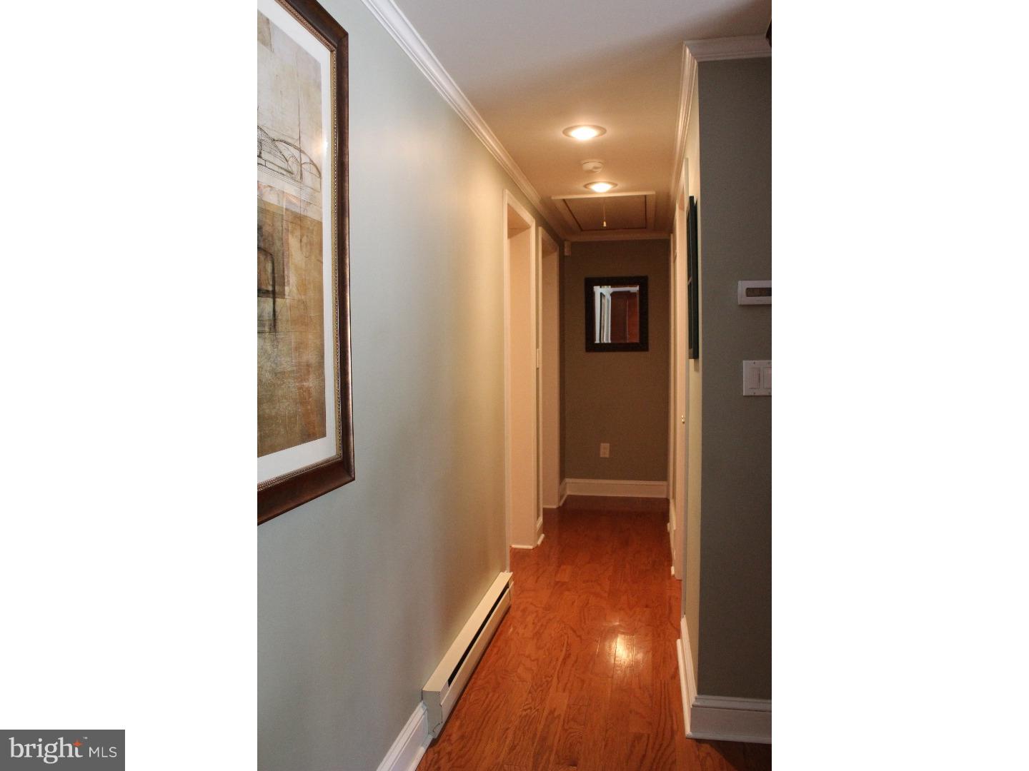 109 Prospect Road Sicklerville, NJ 08081 - Photo 13 of 20 a view of a hallway with wooden floor