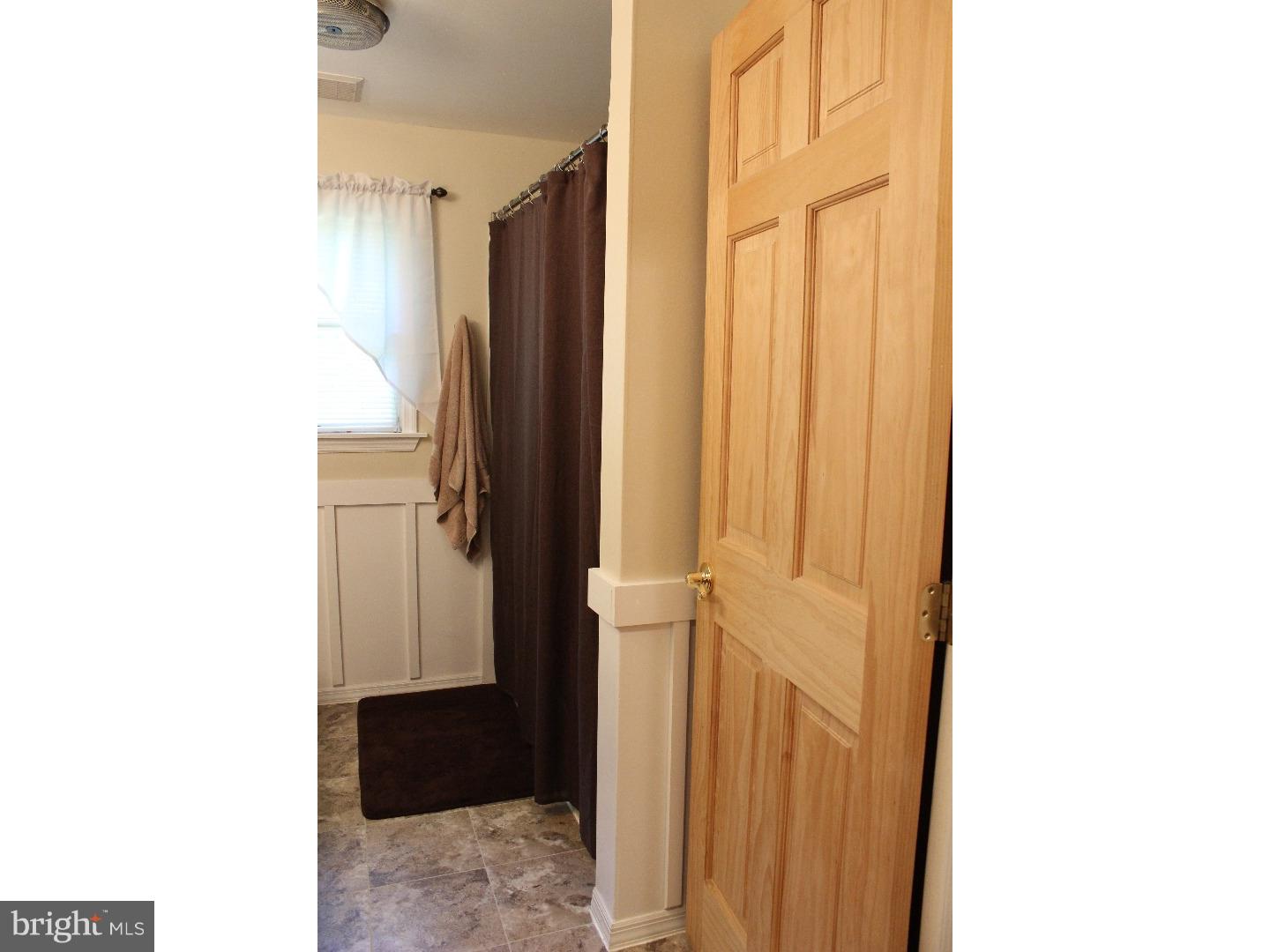 109 Prospect Road Sicklerville, NJ 08081 - Photo 15 of 20 a view of a bathroom with a sink and a mirror