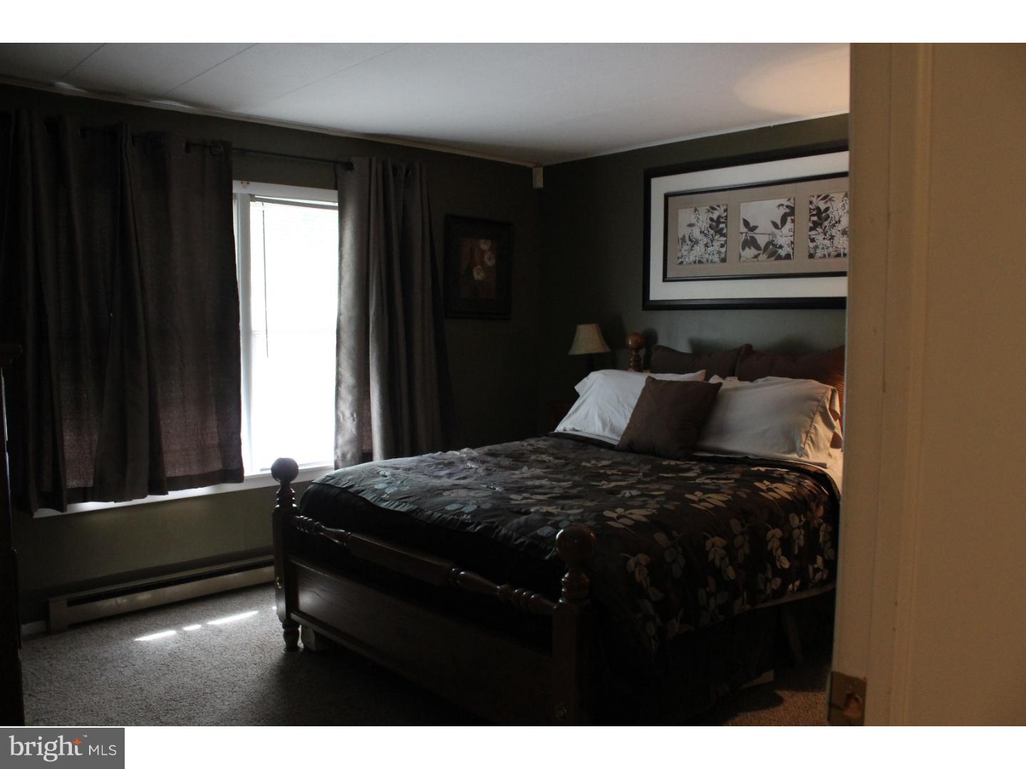 109 Prospect Road Sicklerville, NJ 08081 - Photo 16 of 20 a bed sitting in a bedroom next to a window