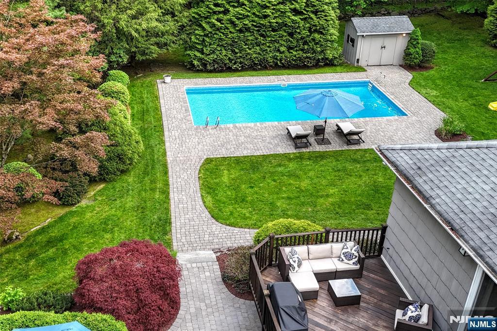 60 Dimmig Road Upper Saddle River, NJ 07458 - Photo 5 of 40 a view of a swimming pool with a seating space