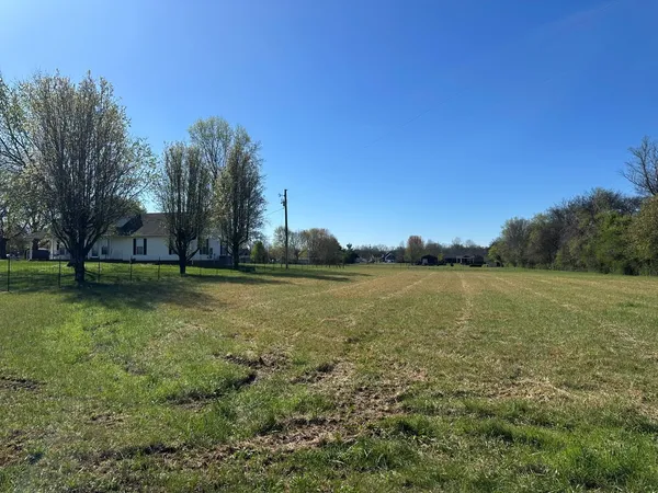 a view of lake with green space