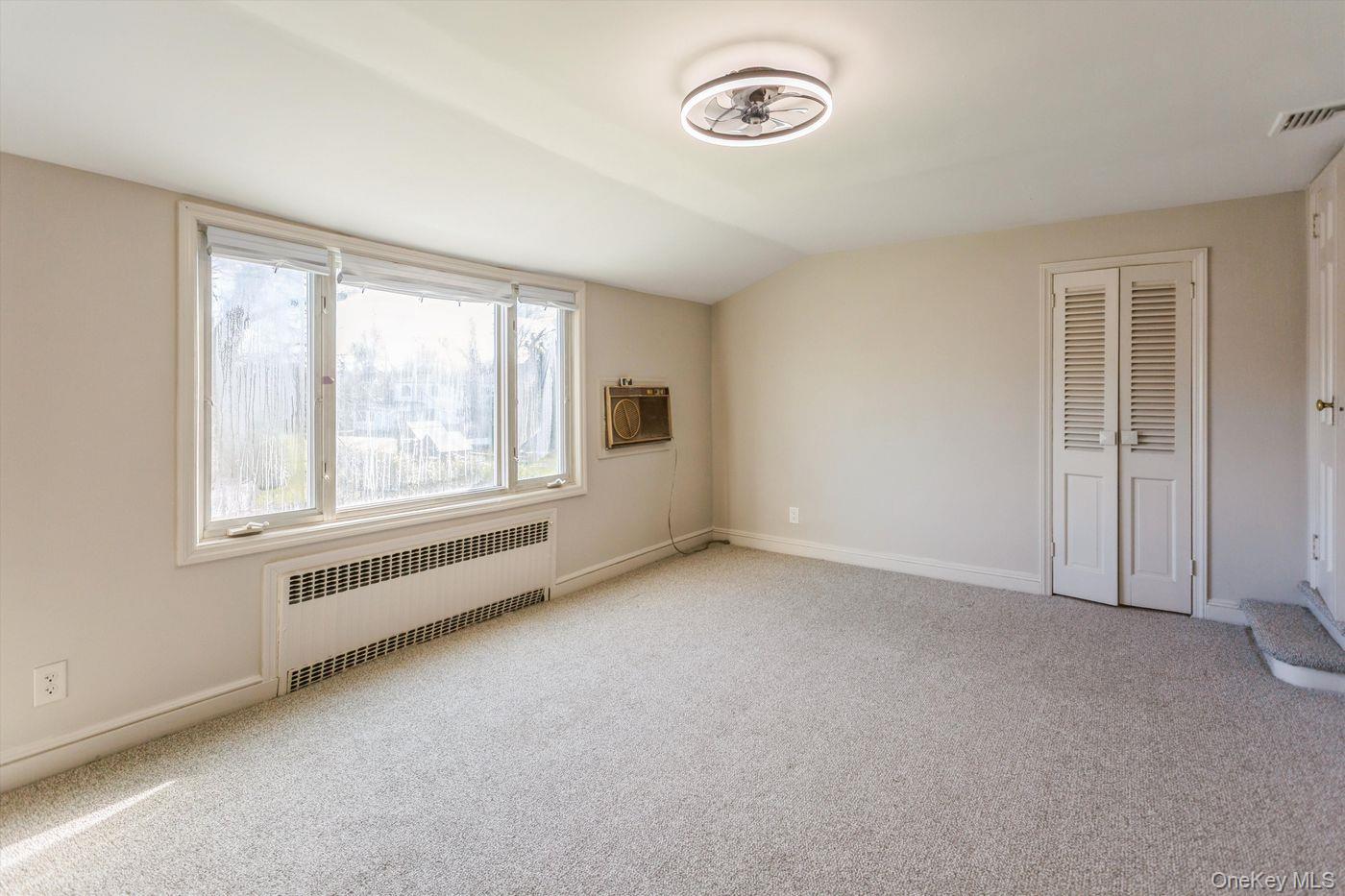 1 Sutton Place Lawrence, NY 11559 - Photo 16 of 38 an empty room with windows