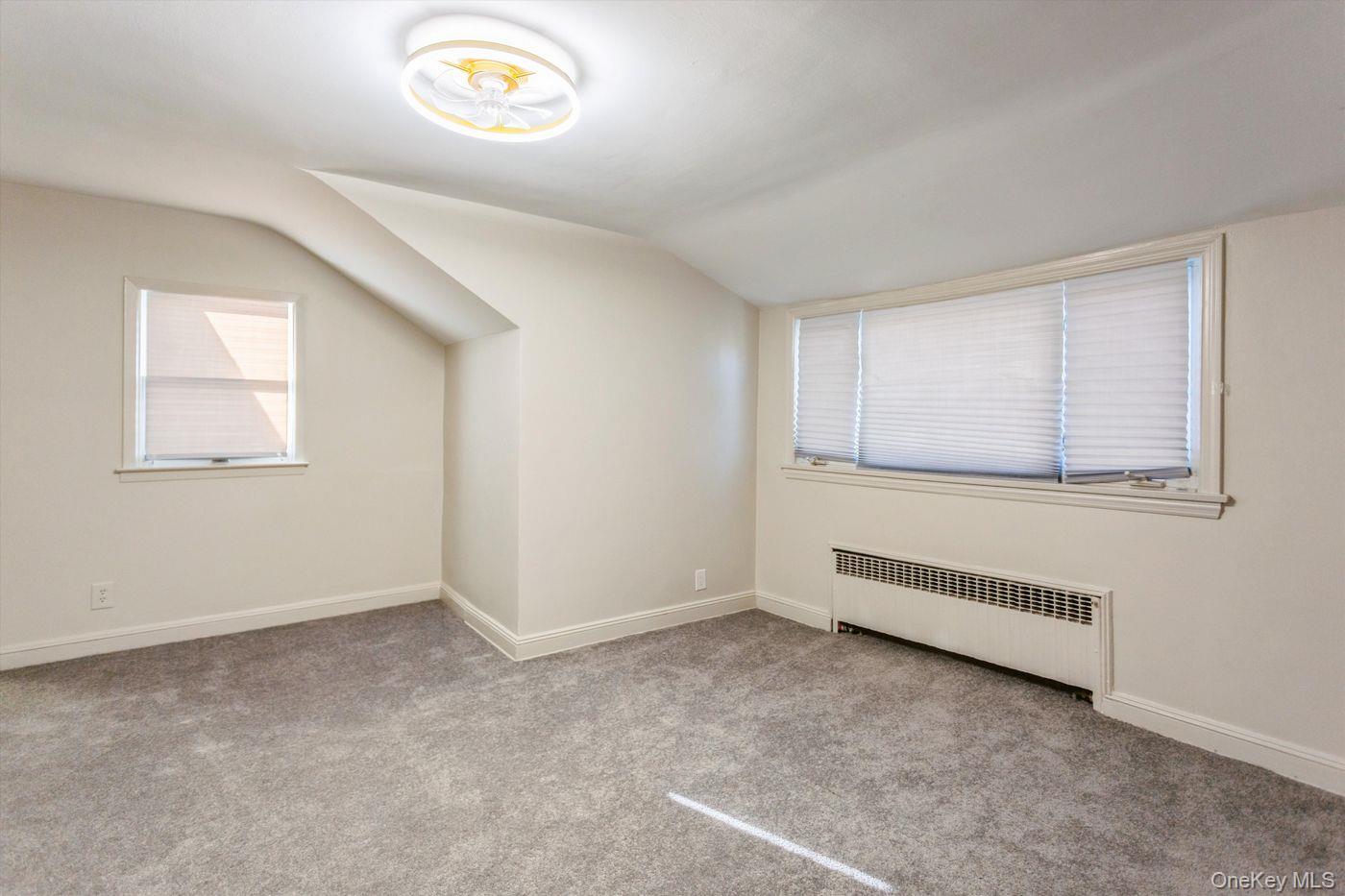 1 Sutton Place Lawrence, NY 11559 - Photo 22 of 38 an empty room with a window