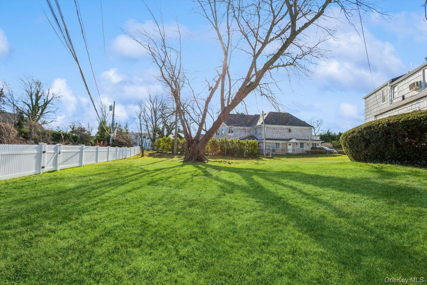 1 Sutton Place Lawrence, NY 11559 - Photo 38 of 38 a view of a park with large trees