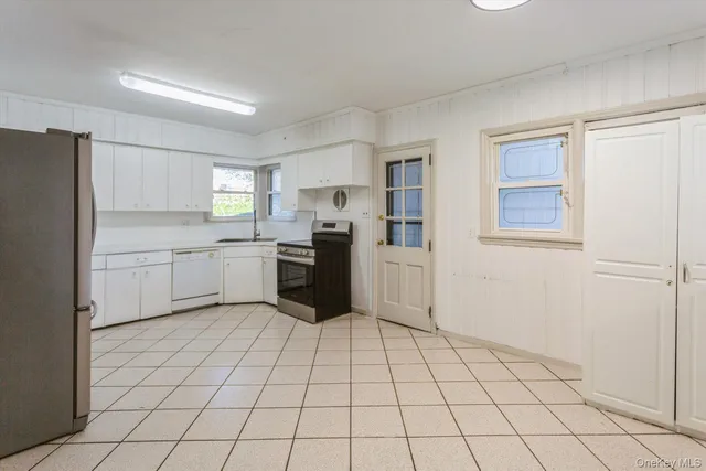 a room with wooden floor and lounge chair
