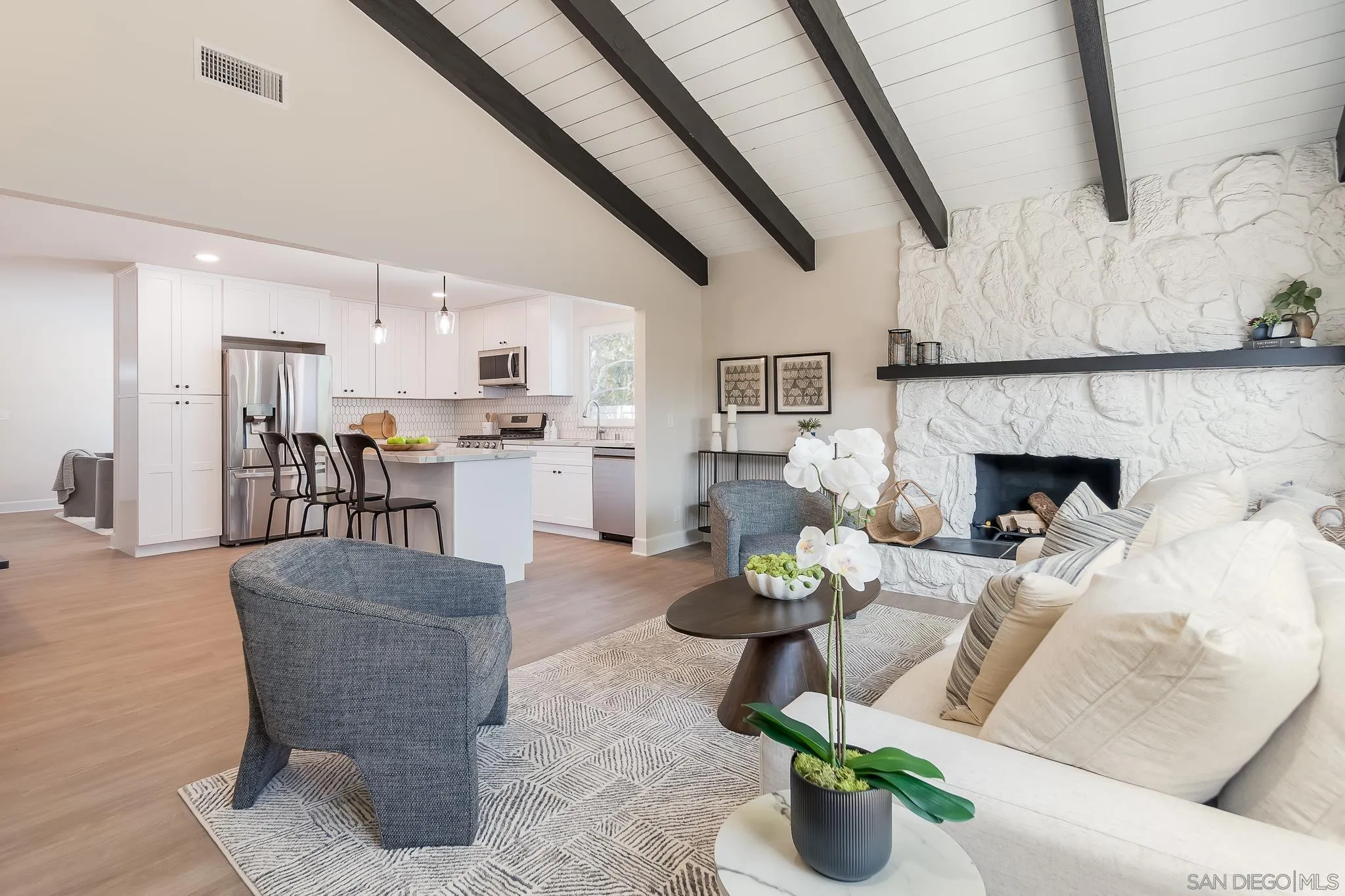 8510 Lepus Road San Diego, CA 92126 - Photo 1 of 35 a living room with furniture and a fireplace