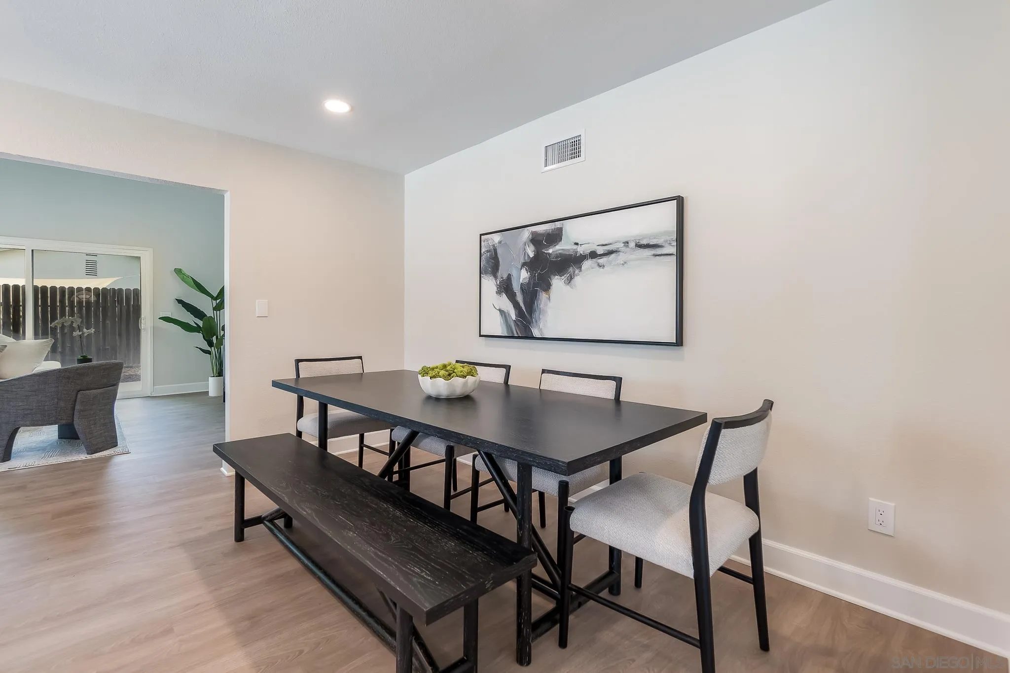 8510 Lepus Road San Diego, CA 92126 - Photo 12 of 35 a view of a dining room with furniture and wooden floor
