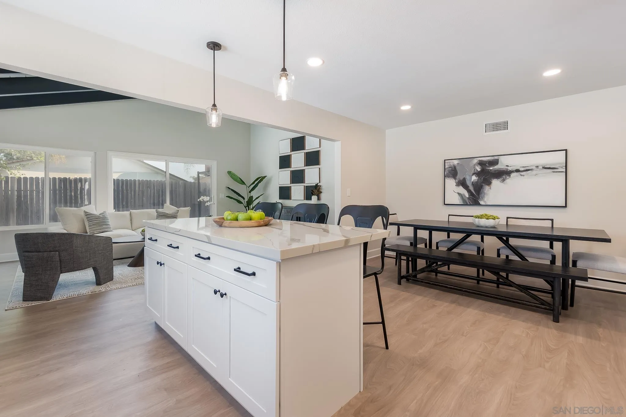 8510 Lepus Road San Diego, CA 92126 - Photo 15 of 35 a large white kitchen with a large island in the center