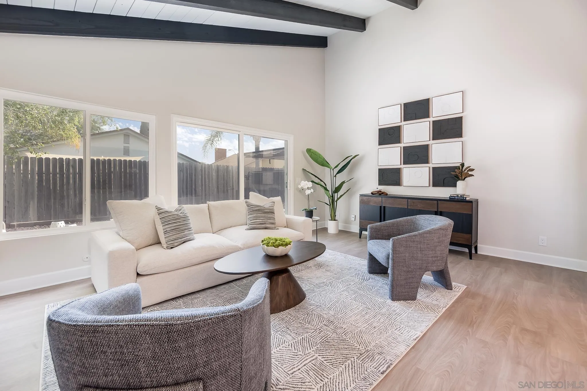 8510 Lepus Road San Diego, CA 92126 - Photo 16 of 35 a living room with furniture and a potted plant