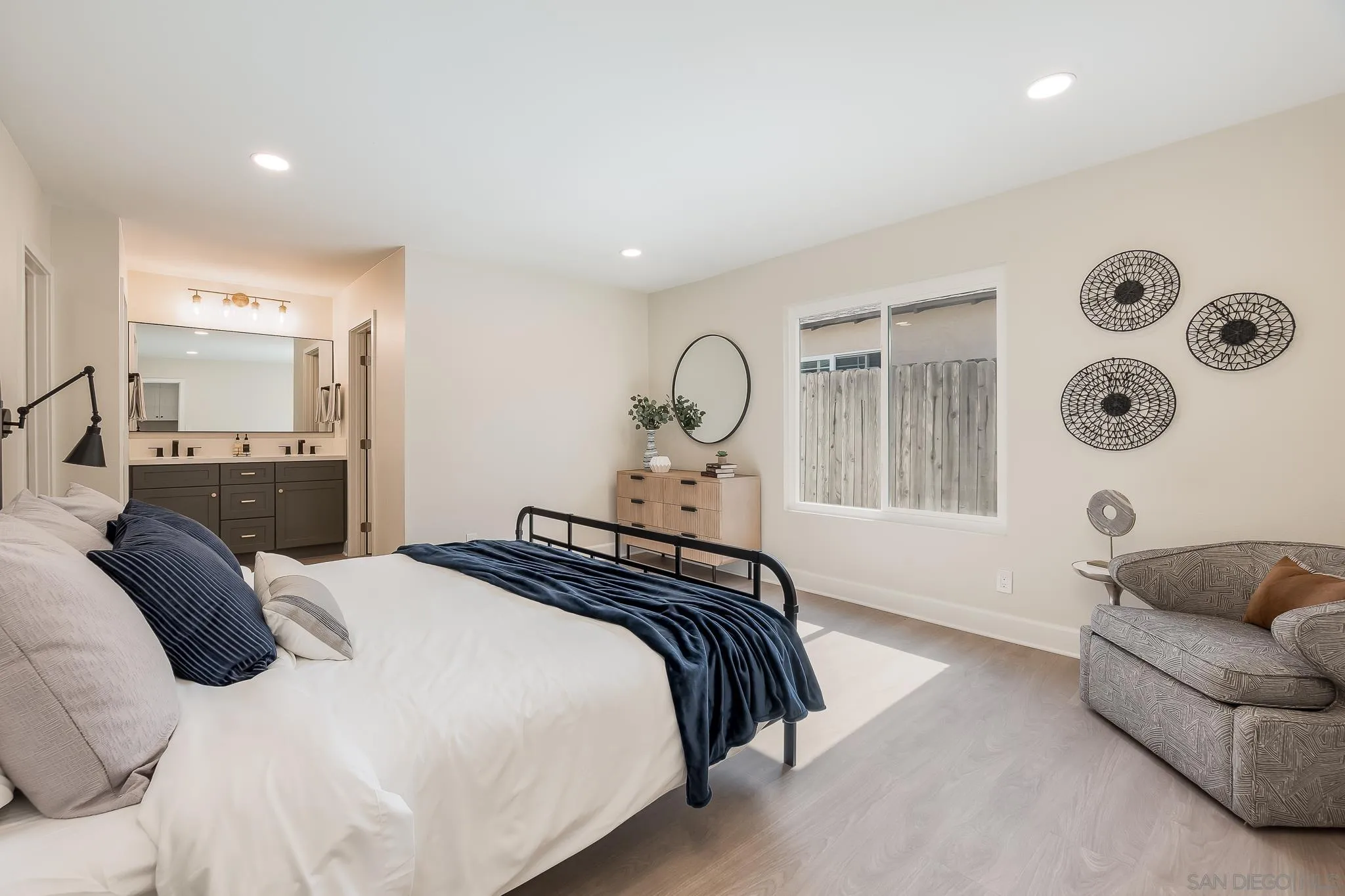 8510 Lepus Road San Diego, CA 92126 - Photo 17 of 35 a bedroom with a bed couch and a window