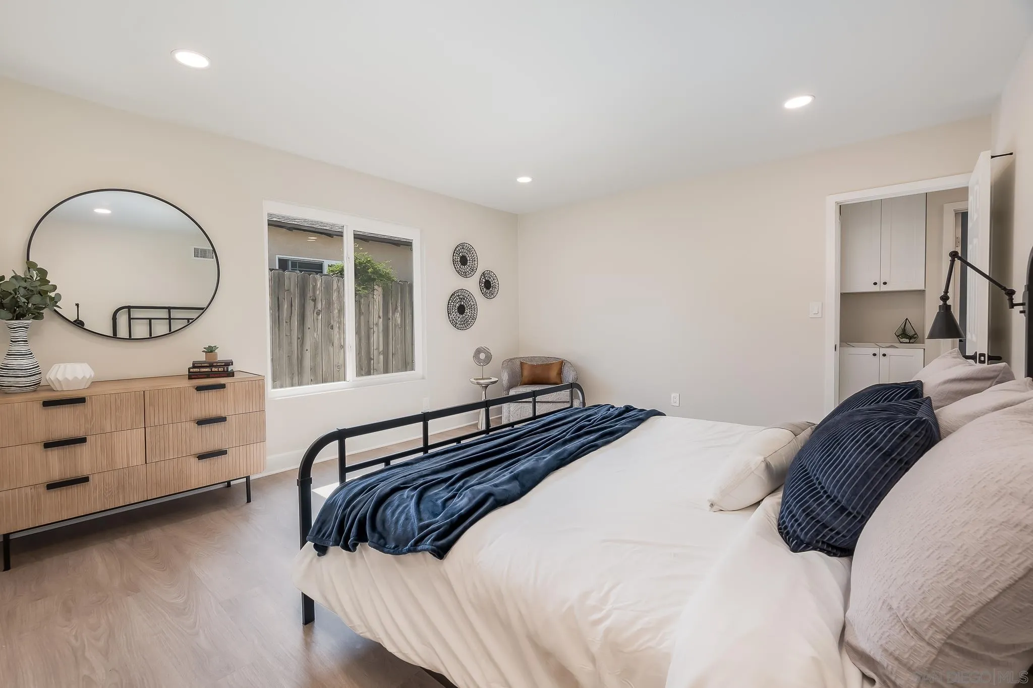 8510 Lepus Road San Diego, CA 92126 - Photo 20 of 35 a bedroom with a bed and a dresser