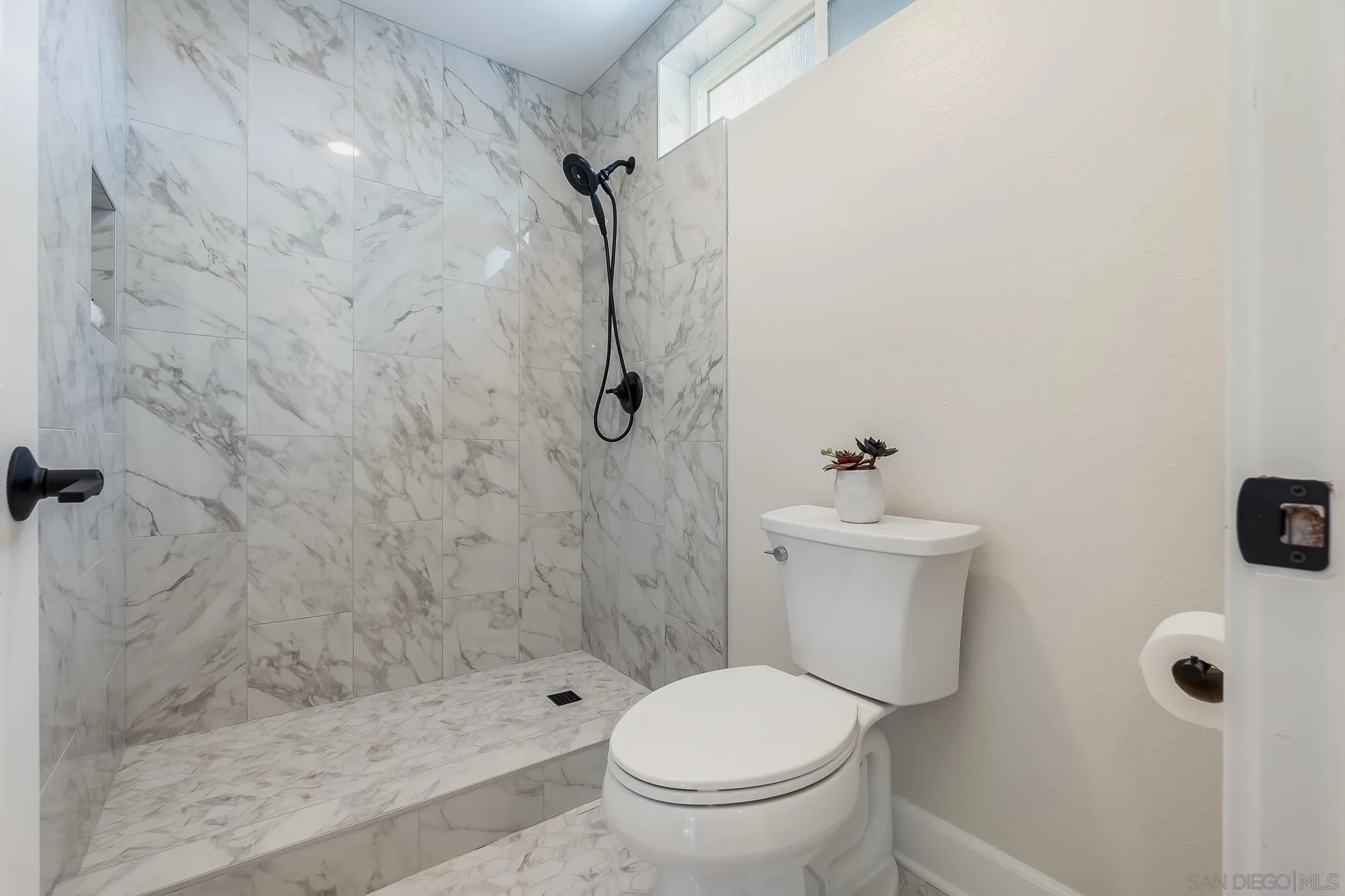 8510 Lepus Road San Diego, CA 92126 - Photo 21 of 35 a bathroom with a toilet and shower