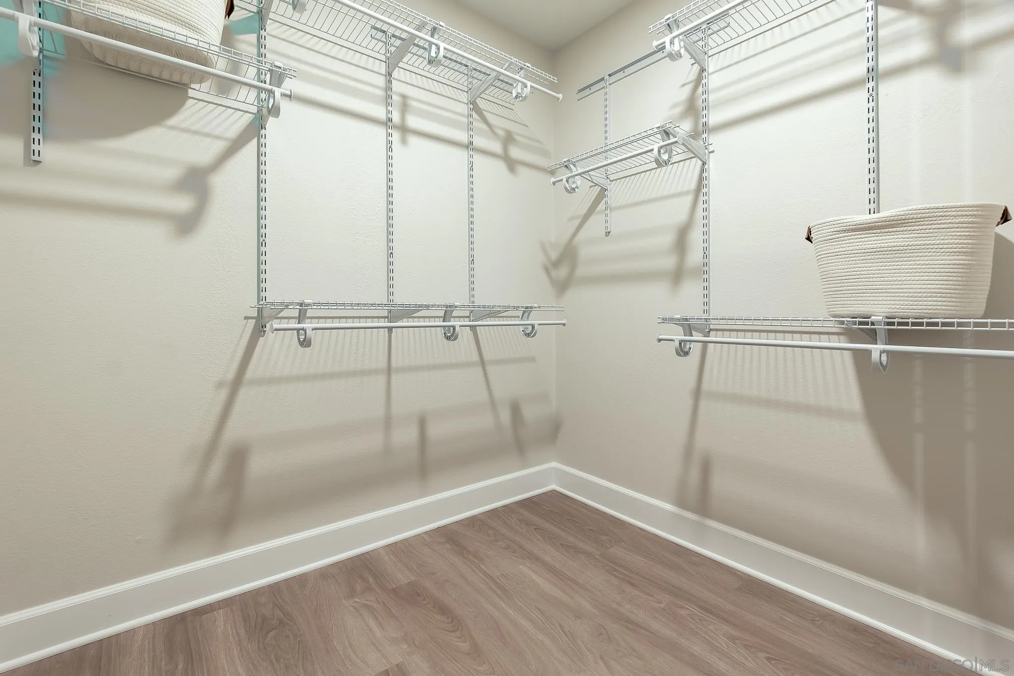 8510 Lepus Road San Diego, CA 92126 - Photo 22 of 35 a view of a room with wooden floor