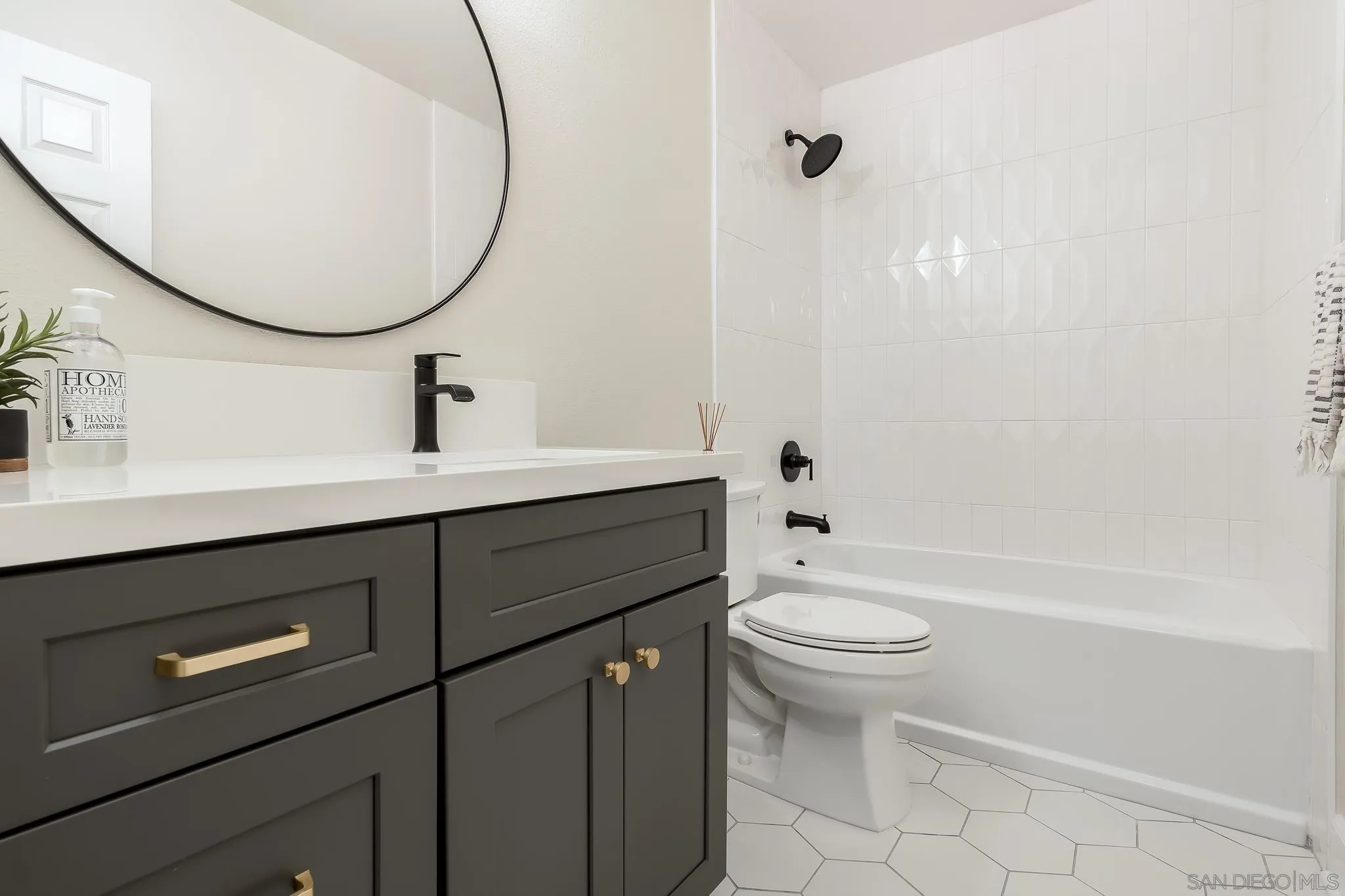 8510 Lepus Road San Diego, CA 92126 - Photo 23 of 35 a bathroom with a sink a toilet and a mirror