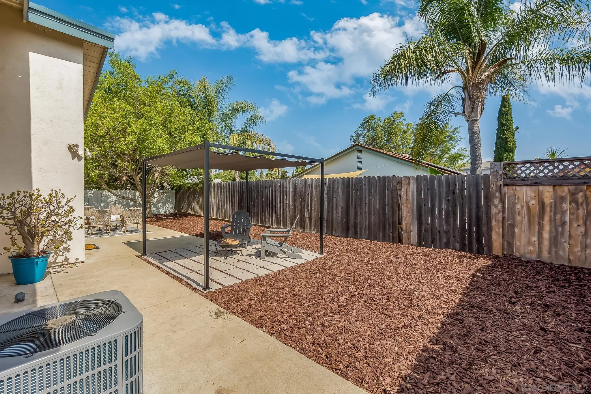 8510 Lepus Road San Diego, CA 92126 - Photo 26 of 35 a backyard of a house with table and chairs