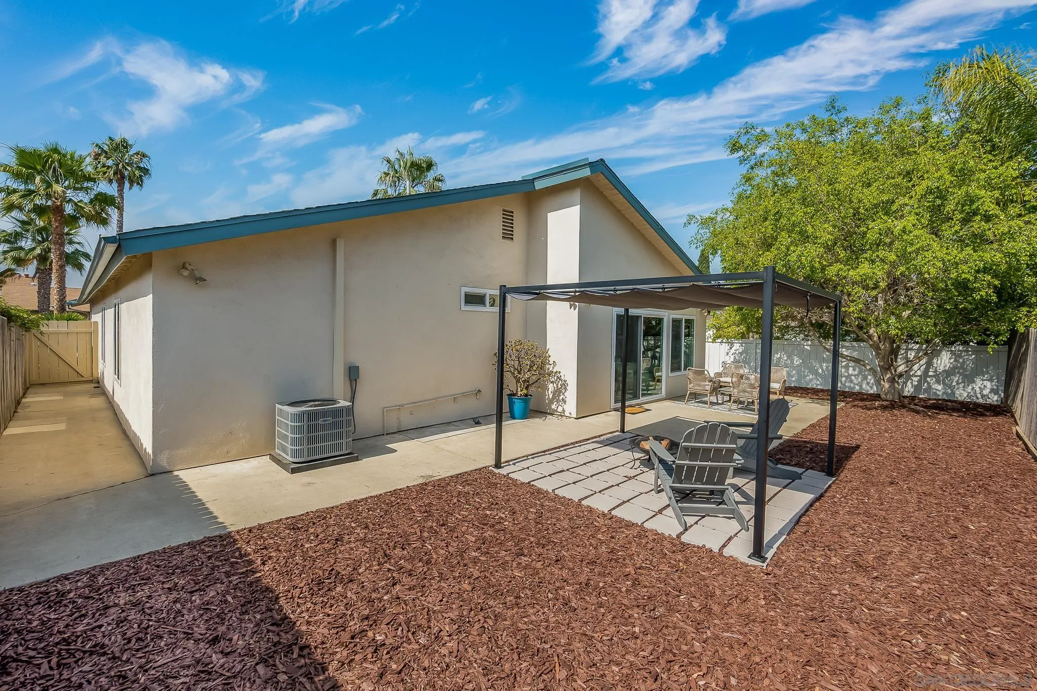 8510 Lepus Road San Diego, CA 92126 - Photo 30 of 35 a view of a house with backyard and sitting area