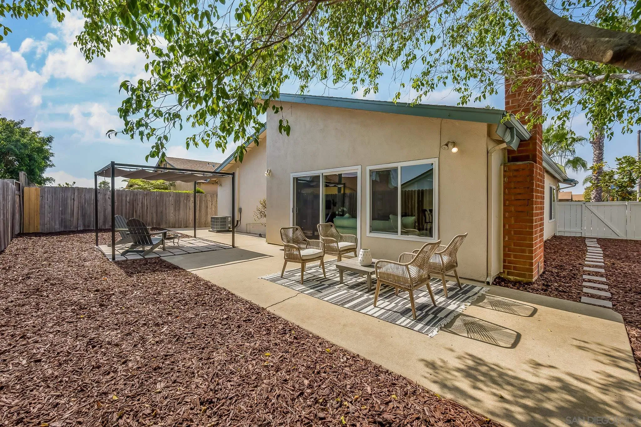 8510 Lepus Road San Diego, CA 92126 - Photo 3 of 35 a front view of house with yard seating and green space