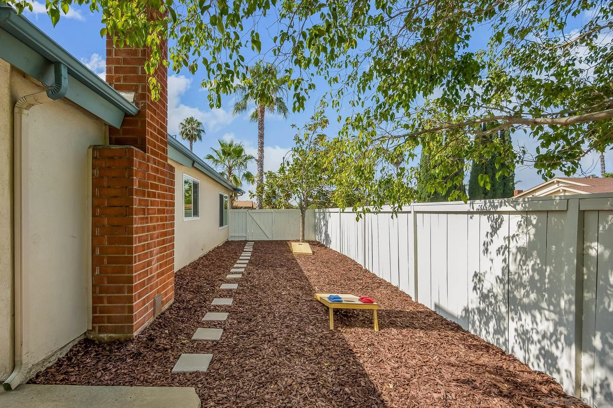 8510 Lepus Road San Diego, CA 92126 - Photo 31 of 35 a view of backyard with small cabin and wooden fence