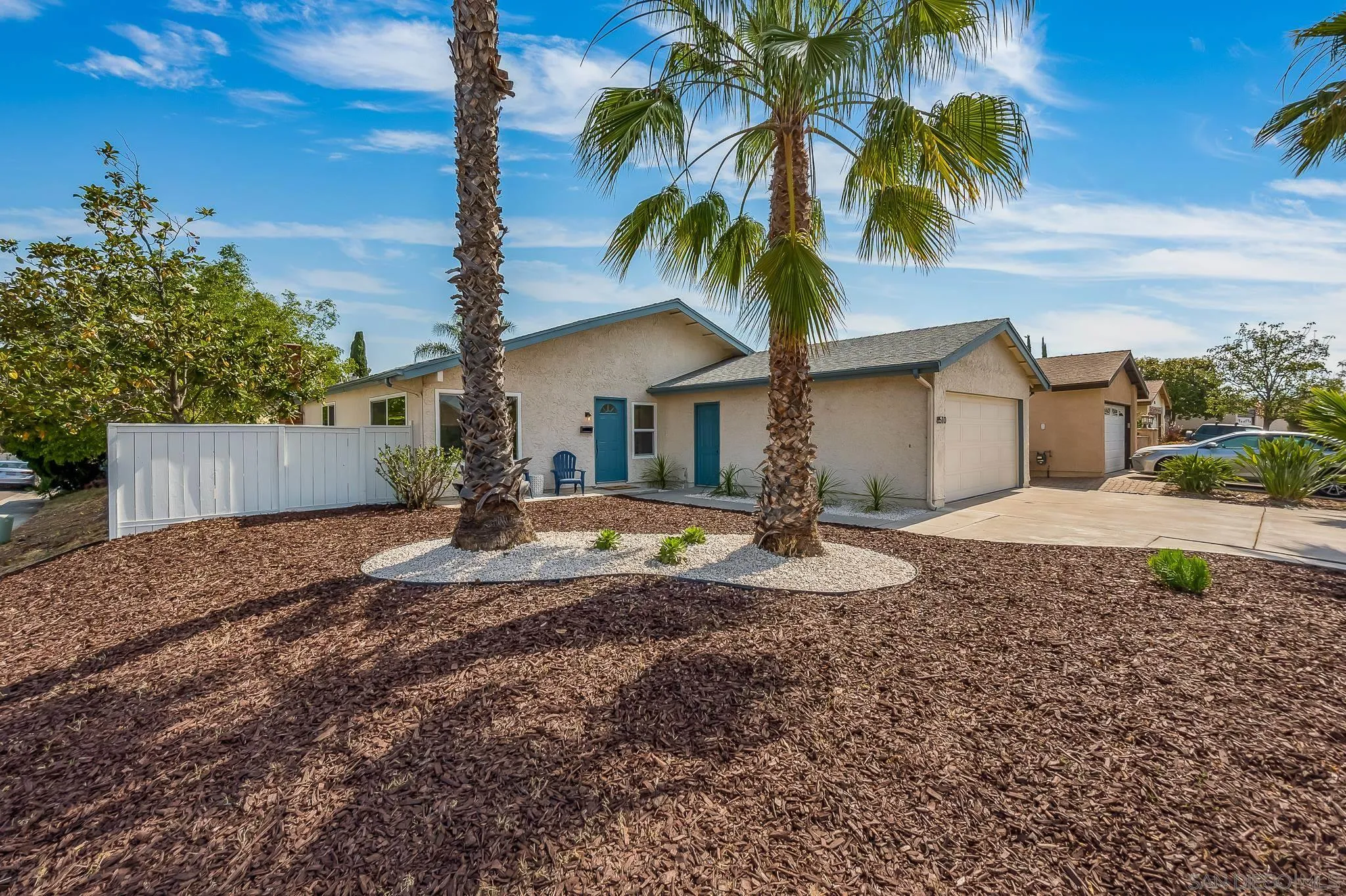8510 Lepus Road San Diego, CA 92126 - Photo 6 of 35 a view of a house with a yard and palm trees