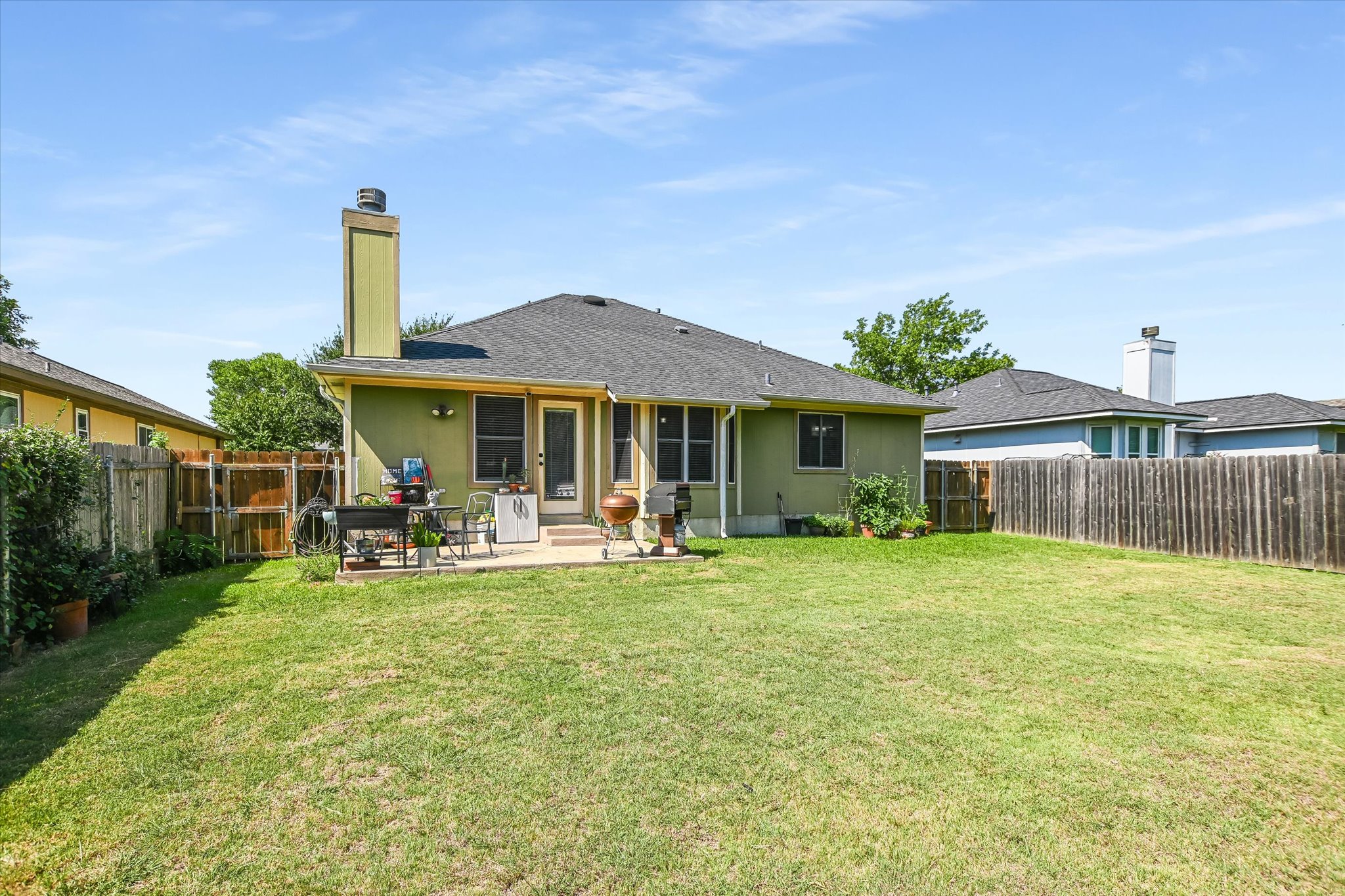 1302 Redbud Lane Leander, TX 78641 - Photo 26 of 28 a view of a house with backyard porch and sitting area