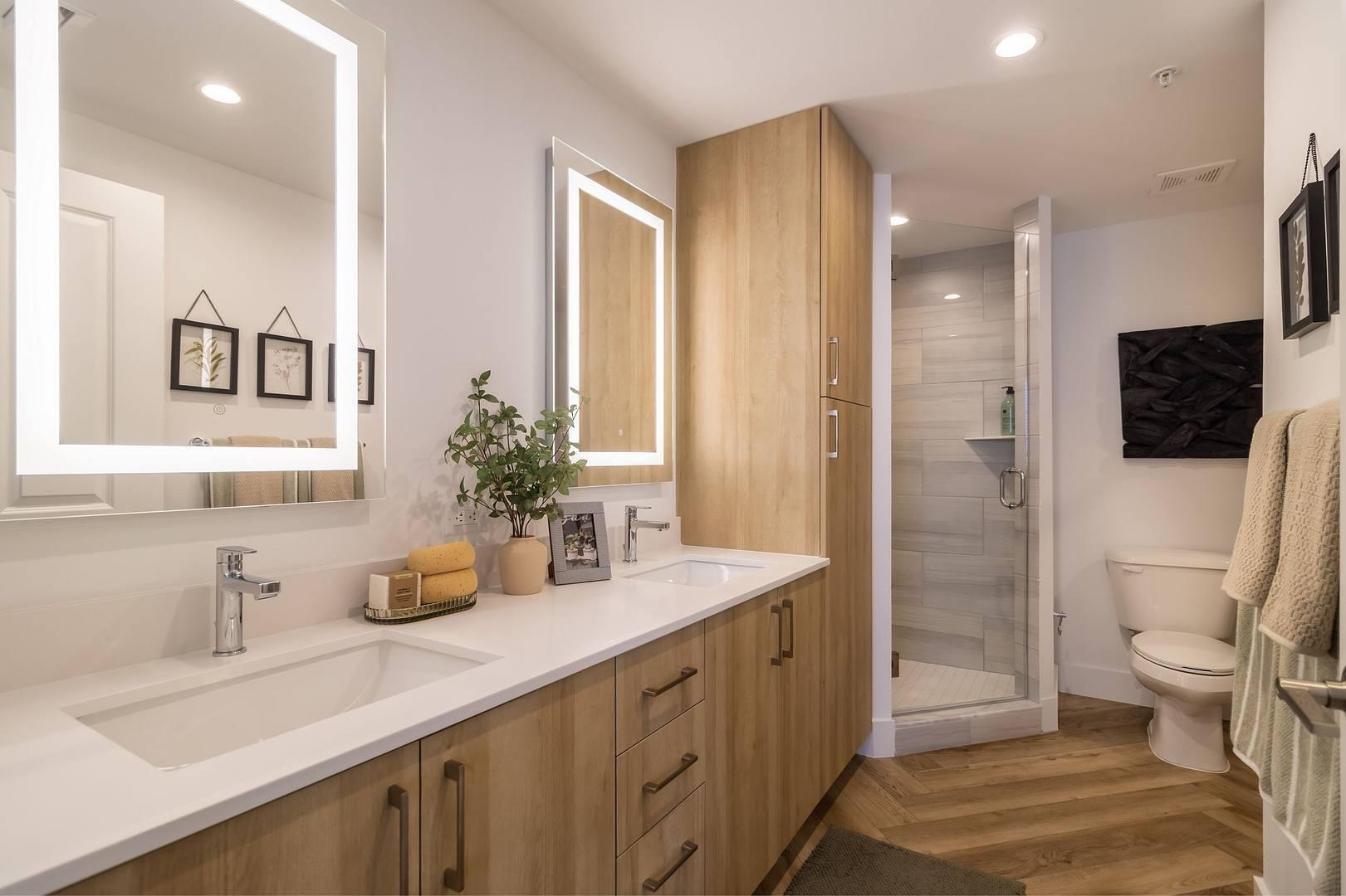 11280 Channing Way, Unit 203 Royal Palm Beach, FL 33414 - Photo 13 of 24 a spacious bathroom with a double vanity sink toilet and shower
