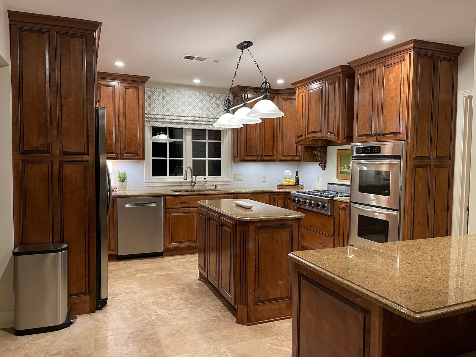 195 South Grove Park Road Memphis, TN 38117 - Photo 6 of 25 a kitchen that has a sink a stove and a refrigerator