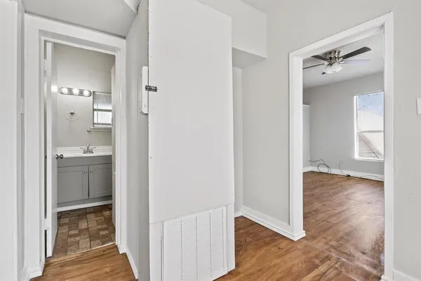 a view of a house with a big yard plants and large trees