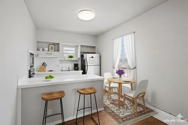 a dining room with a table and chairs