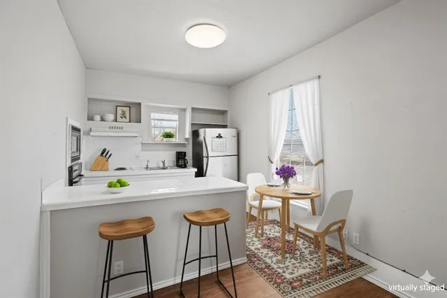 a dining room with a table and chairs