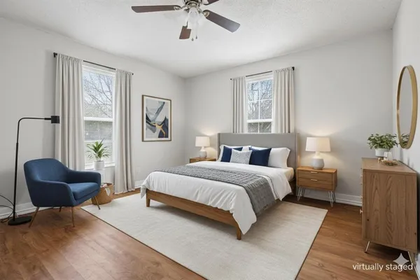 a spacious bedroom with a large bed and a couch