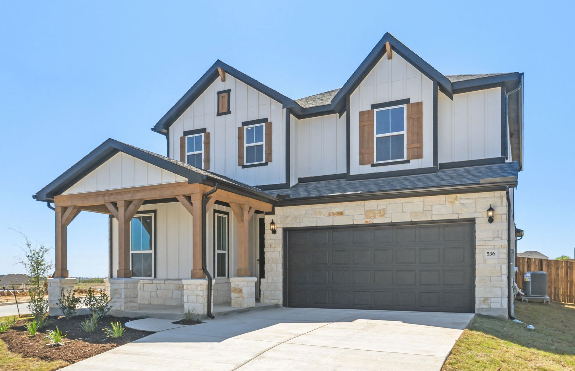 536 Rubber Tree Way Buda, TX 78610 - Photo 3 of 32 a front view of a house with parking