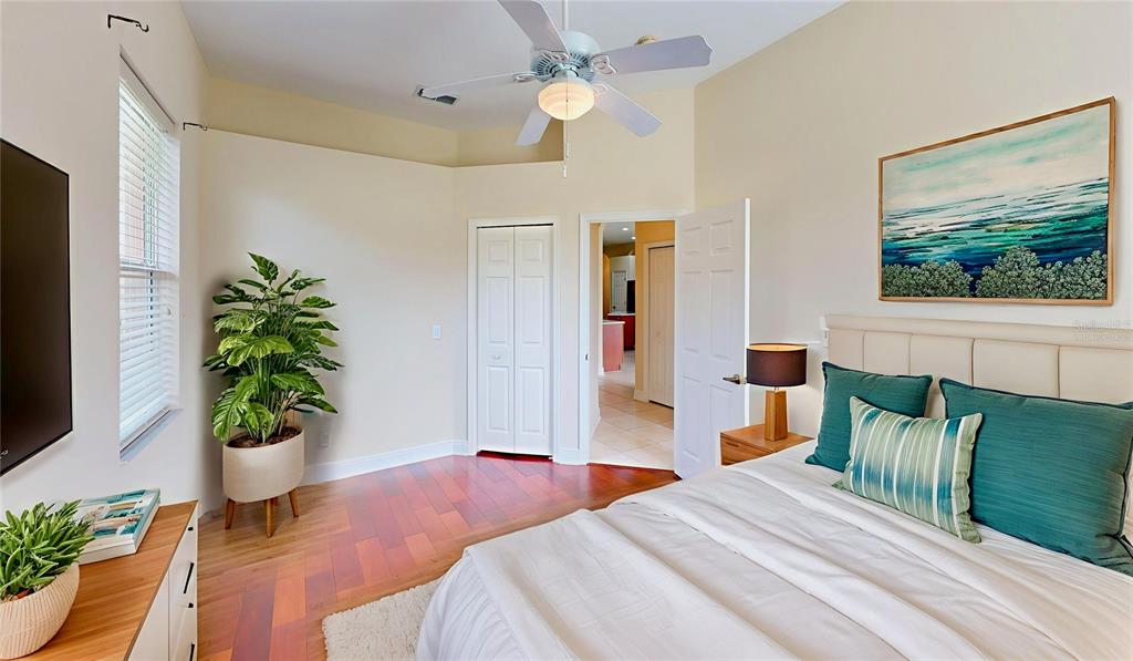 586 Huntington Pines Drive Ocoee, FL 34761 - Photo 12 of 51 a bedroom with a bed and a potted plant