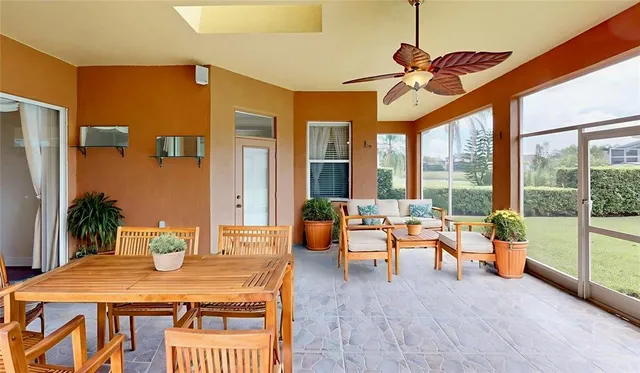 a dining room with furniture water view and a chandelier