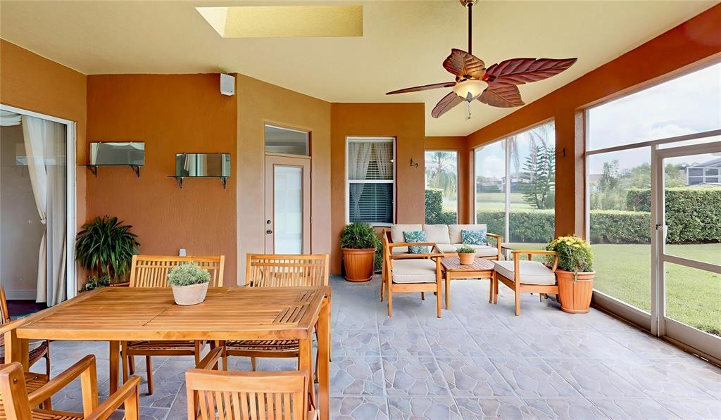 586 Huntington Pines Drive Ocoee, FL 34761 - Photo 14 of 51 a dining room with furniture water view and a chandelier