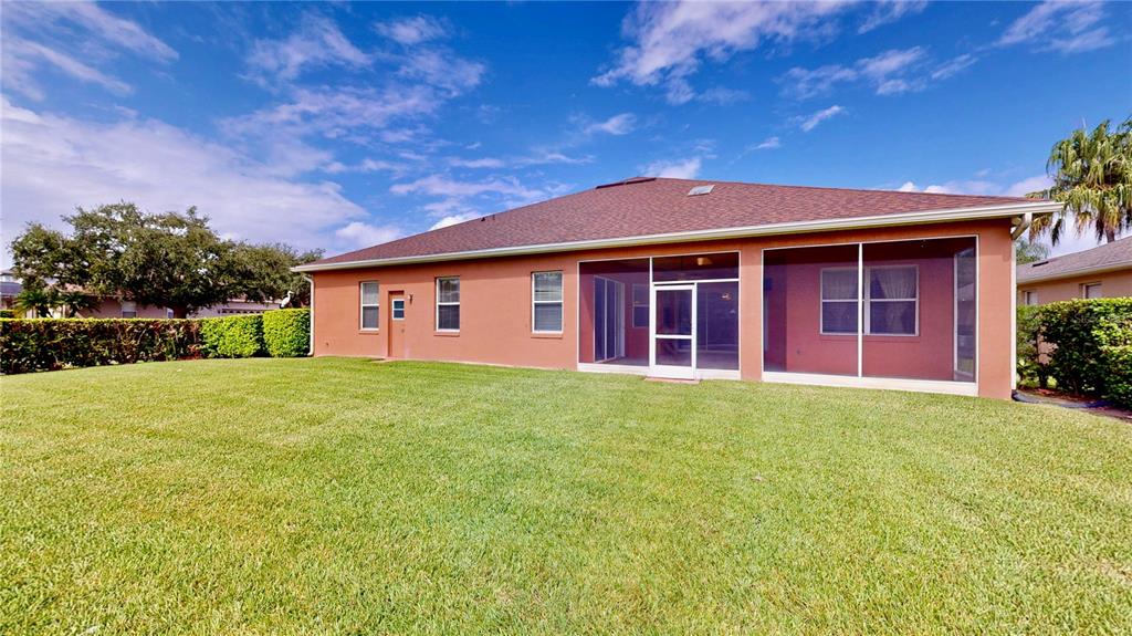 586 Huntington Pines Drive Ocoee, FL 34761 - Photo 15 of 51 a view of a yard in front of a house with large tree