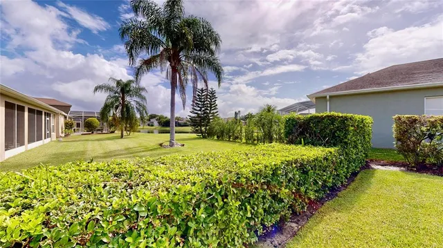a swimming pool with outdoor seating and yard