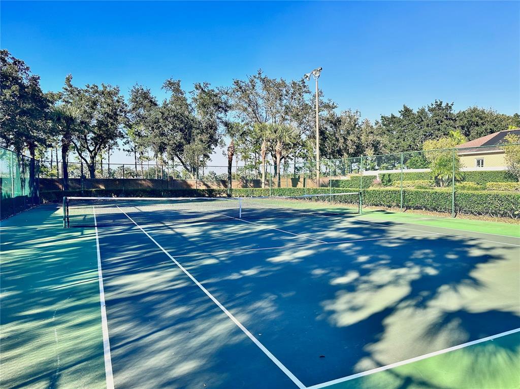 586 Huntington Pines Drive Ocoee, FL 34761 - Photo 22 of 51 a view of outdoor space and tennis court