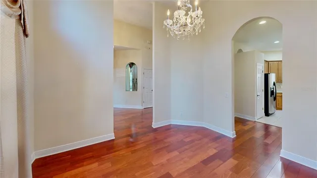 a view of livingroom with hardwood floor and hallway