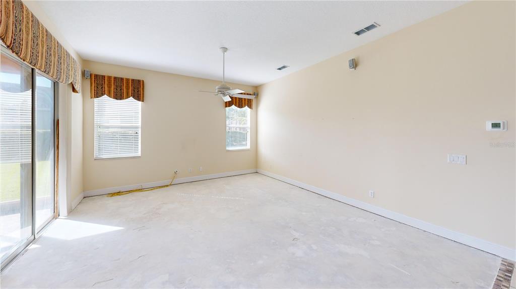 586 Huntington Pines Drive Ocoee, FL 34761 - Photo 32 of 51 a view of an empty room with a window
