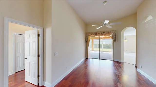a view of a room with wooden floor