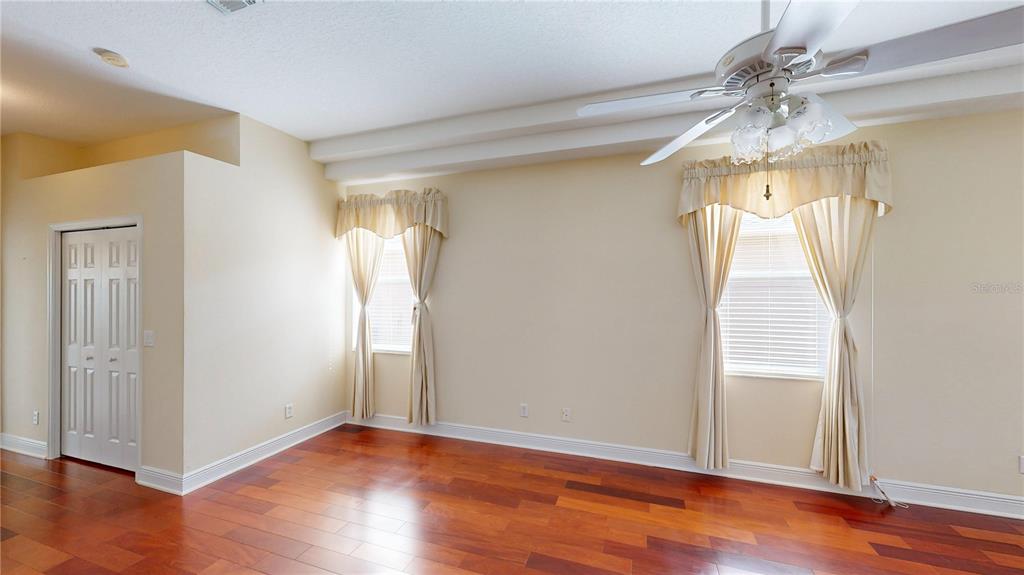 586 Huntington Pines Drive Ocoee, FL 34761 - Photo 36 of 51 a view of empty room with wooden floor and fan