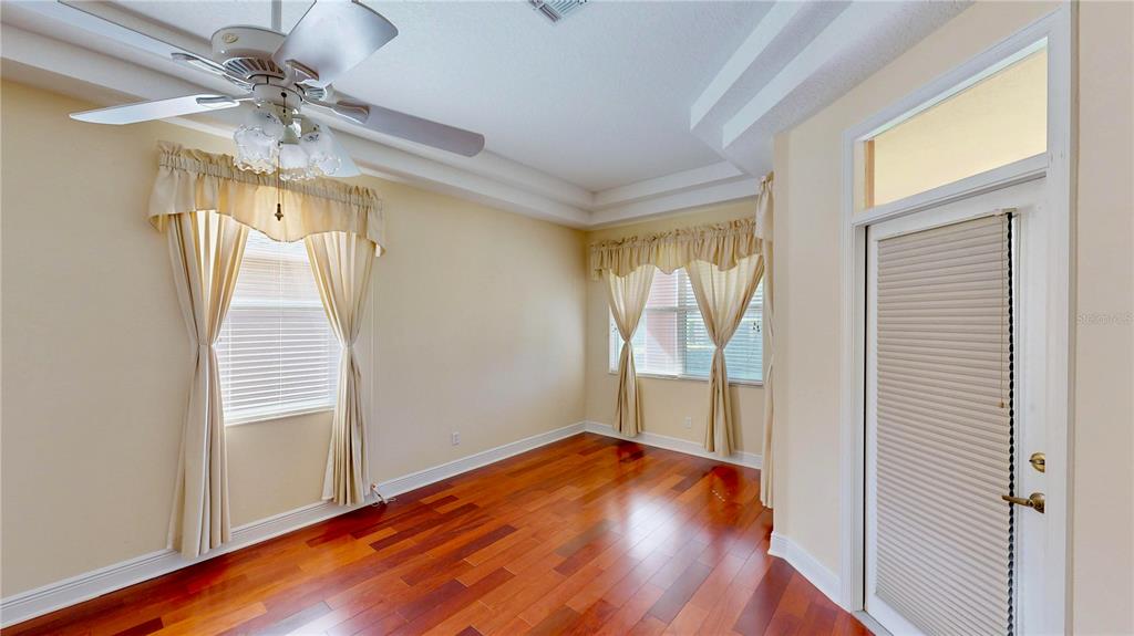 586 Huntington Pines Drive Ocoee, FL 34761 - Photo 37 of 51 wooden floor in an empty room with a window