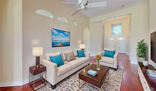 a living room with furniture and a lamp