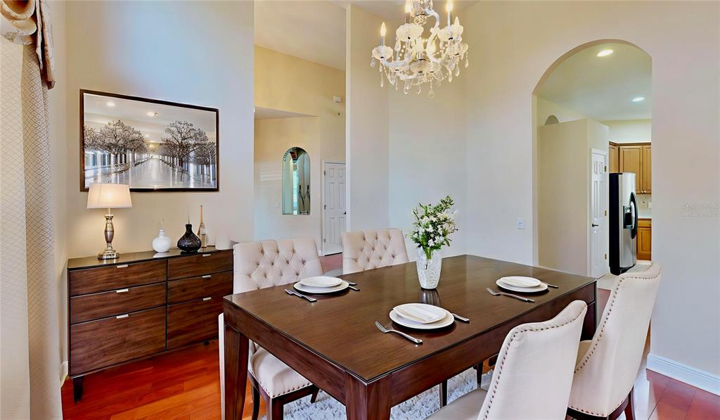 586 Huntington Pines Drive Ocoee, FL 34761 - Photo 5 of 51 a view of a dining room with furniture and chandelier