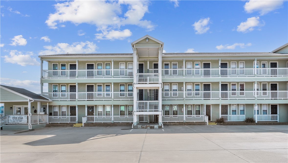 a front view of a building with a lot of windows